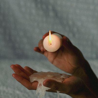 Close-up of hands in a meditative gesture.